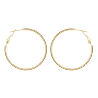 Boucles d'oreilles Calyce créoles dorées texturées Hersée Hersée Paris 9