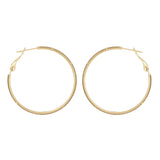 Boucles d'oreilles Calyce créoles dorées texturées Hersée Hersée Paris 9